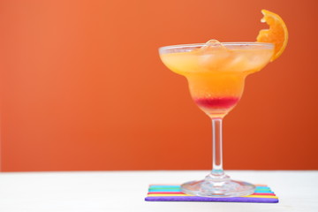 orange margarita on wood table