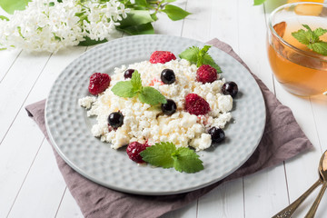 Russian cottage cheese with berries, honey mint, selective focus, healthy Breakfast