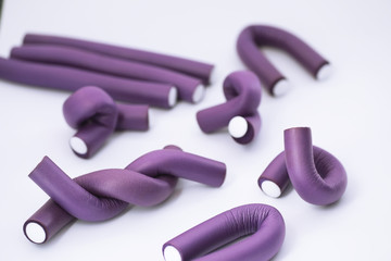 Female colored curlers and hair pins