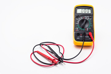 Electric multimeter with red and black probe, display indicating zero. Isolated on a white background with a clipping path.