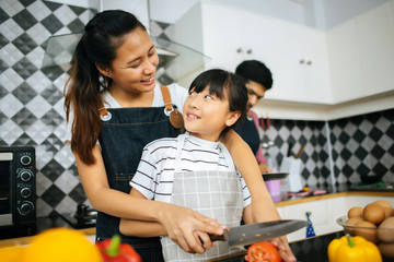 Family cooking time : Happy family help cooking meal together in kitchen at home..
