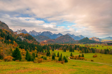 Scenic view of Alpine valley with Neuschwanstein and Hohenschwangau castles at autumn morning