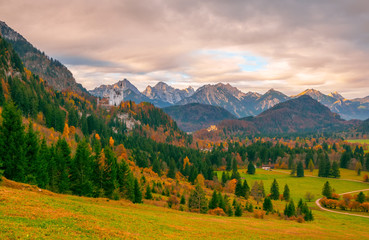 Fototapeta na wymiar Scenic view of Alpine valley with Neuschwanstein and Hohenschwangau castles at autumn morning