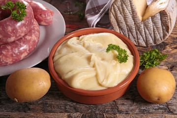 french aligot with cheese, potato and sausage