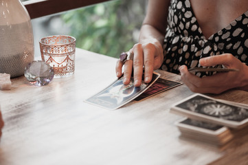 Woman is reading Tarot cards