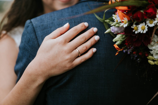 Close up of bride's hand with wedding ring