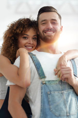 Close-up portrait of a newlywed couple on a background of boxes