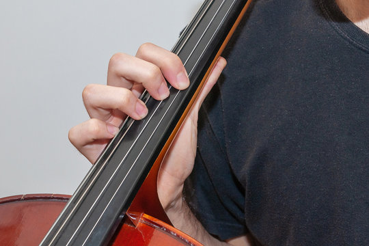 fingers on strings close up