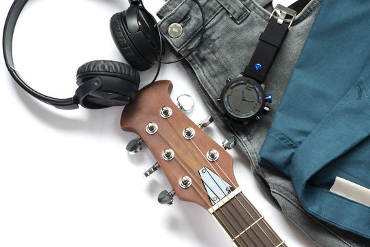 Men's casual outfits for man clothing with guitar, jeans, watch, earphone and shirt isolated on white background, Top view. pack shot