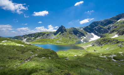 Naklejka na ściany i meble The Seven Rila Lakes - an incredible creation of nature in Rila mountain, Bulgaria. One of the most visited places of tourists and top landmark. Sightseeing with green and blue colors. Panorama view