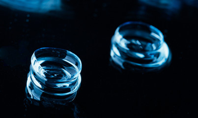 Two contact lenses with reflections