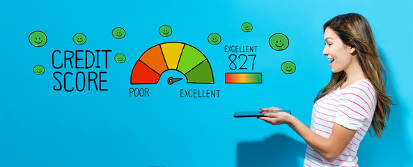 Excellent credit score with young woman using her tablet