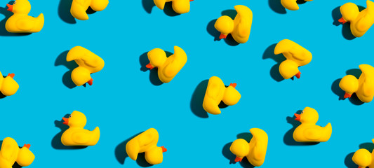 Collection of yellow rubber ducks on a blue background