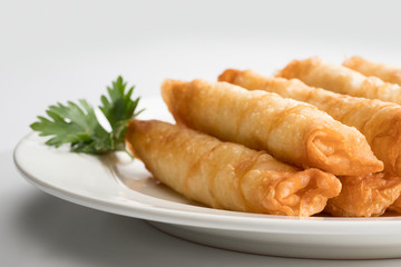 Cigar Pastries on a white plate.