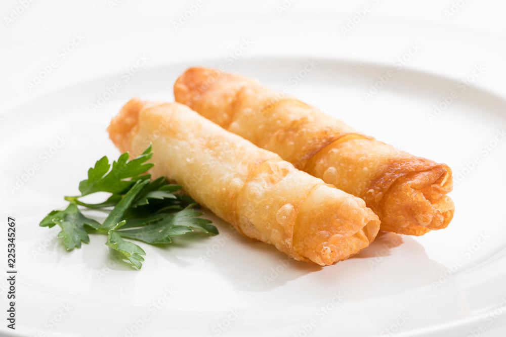 Wall mural Cigar Pastries on a white plate.