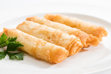 Cigar Pastries on a white plate.