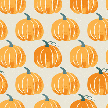 Seamless pattern with pumpkin in pastel colors. Hand drawn colorful vector illustration. Craft stamp style. Halloween or harvest background.
