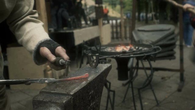 Blacksmith Hammering on a Horseshoe