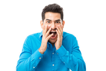 Astonished Man With Mouth Wide Open Over White Background