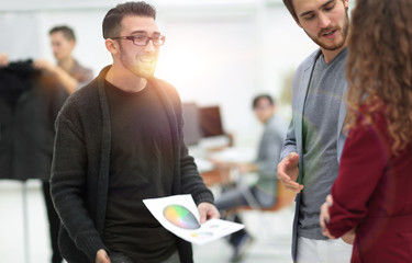 designer talking with a client in a modern Studio.
