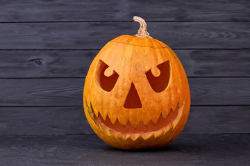 Halloween Pumpkin Jack O Lantern. Halloween pumpkin with angry expression on black background....