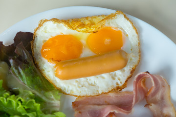 Breakfast with fried egg and bacon