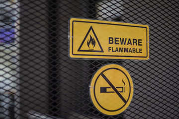 Sign Beware flammable and label no smoking metal
