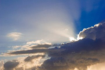 Naklejka na ściany i meble dramatic sky with clouds and shiny light rays
