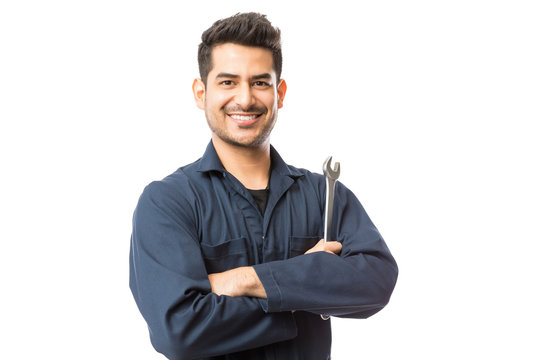 Mechanic With Wrench Standing Hands Folded On White Background