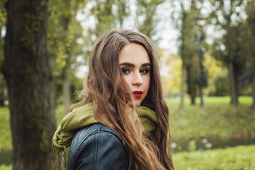 Fototapeta premium Cute woman in green cotton scarf outdoor, portrait