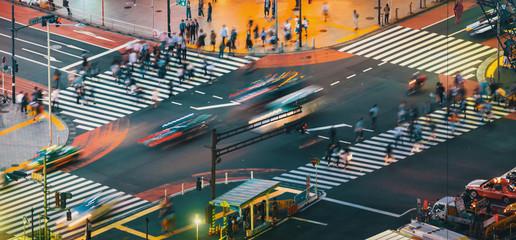 Traffic crosses a busy intersection in Shibuya, Tokyo, Japan