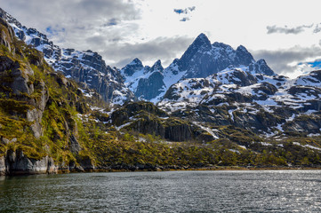 Fjord in Lofoten with snowed mountain, Norway.