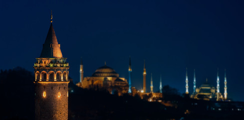 Fototapeta na wymiar Galata Tower at night with Hagia Sophia and The Blue Mosque in Istanbul
