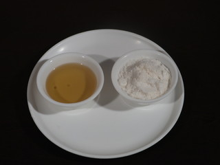 White sea salt isolated on Wooden background,Olive oil on a wooden background, Salt and Olive Oil in White Bowl on Wooden Background, bowl of fresh olive oil and Salt on Wooden Background
