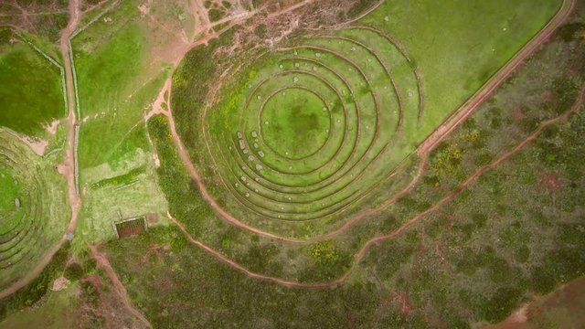 Aerial close up view of terraced circular depressions of Moray, Peru.