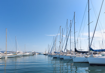 A sunny day in the harbour with yachts and sailing boats