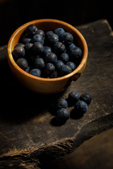 Fresh berries of plums. Harvest. Berries in a wooden bowl of handmade.