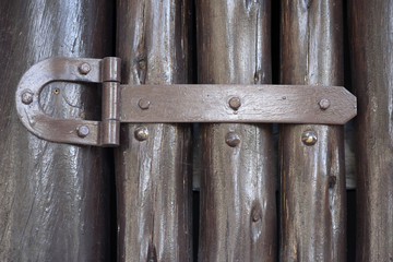 Hinge on brown gate made wooden trunk