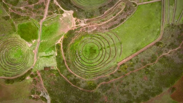 Aerial close up view of terraced circular depressions of Moray, Peru.