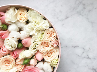 Flowers in a box roses and colorful macaroons macaroni marshmallow cotton