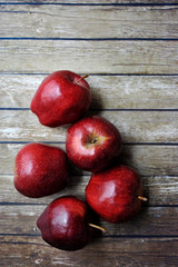 Fresh red apples on the wooden background with sack.Flatlay angle.