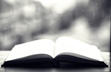 open book and a table black and white