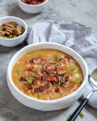 Lentil pea soup garnish with bacon and croutons