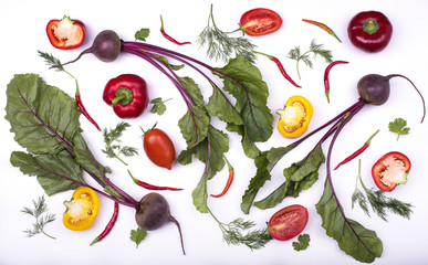 Freshly picked vegetables pattern - beet, tomatoes, pepper, dill, halves of paprika isolated on a white. Flat lay