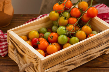 fresh tomatoes in a wooden box