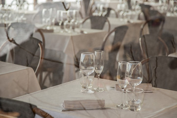 image of a group of glass glasses on a restaurant table