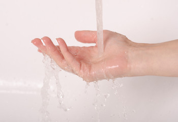 Fototapeta premium Soapy hands water faucet bathroom disinfection care