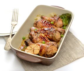 grilled chicken legs with sesame  in a  plate on a white background
