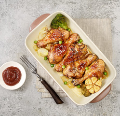 grilled chicken legs with sesame on  plate 