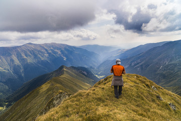 tourist looks at the top mountain landscape